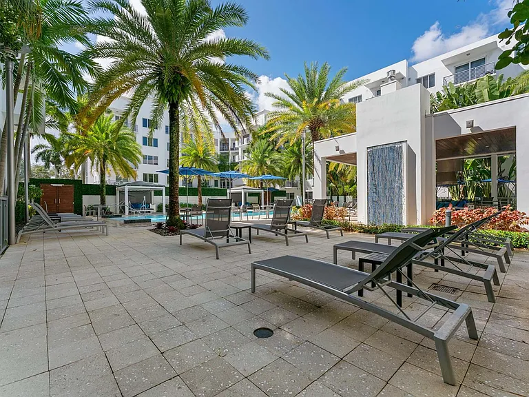 Lounge, soak up the sun, and enjoy the outdoors on a spacious pool patio designed for relaxation and social gatherings