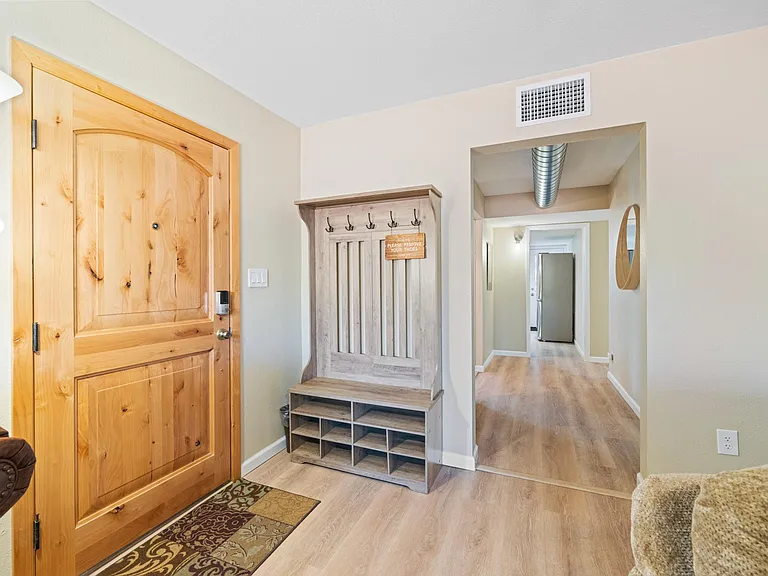 Front Entry Door and Hallway to Living room and Kitchen