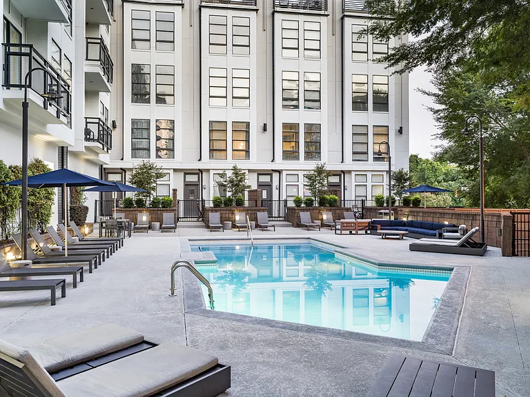 Resort-style swimming pool with sundeck.