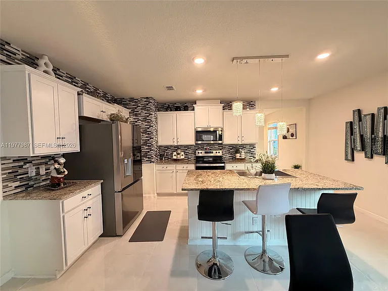 12422 SW Rimini Way — Photo 2