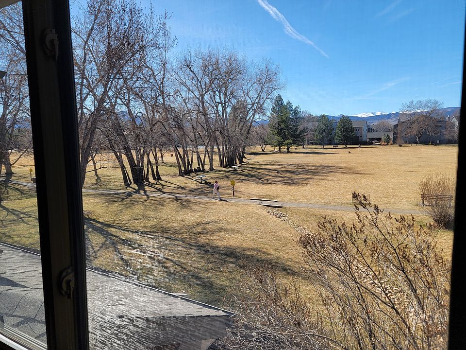View of park and mountains from primary bedroom