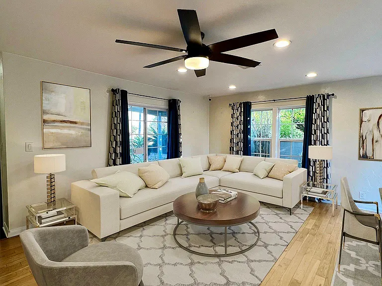 Living room, hardwood floors and fan fixture - partial/ virtual staged