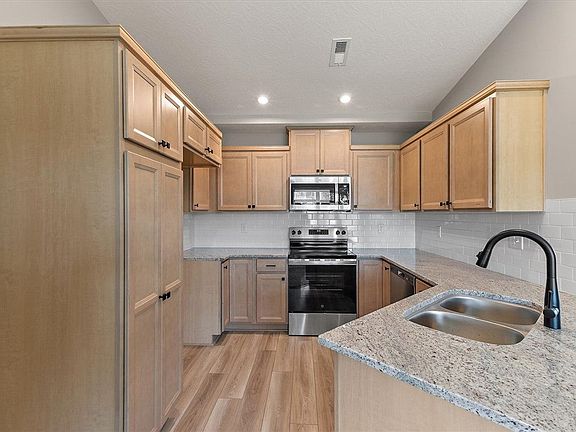 Gleaming granite countertops pair beautifully with