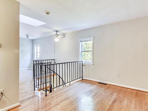 Second floor open floor plan - living room space looking across to eat in kitchen.
