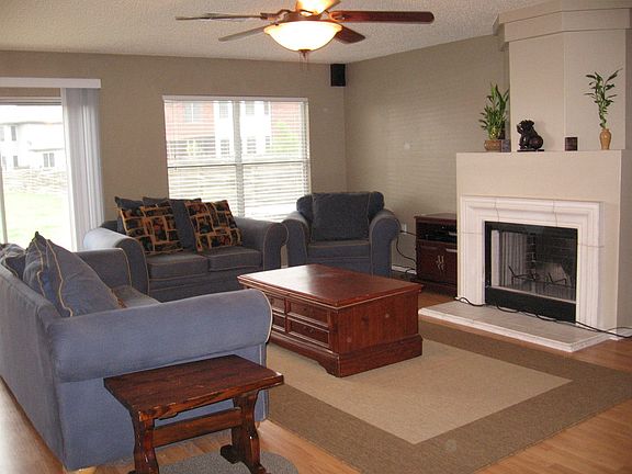 downstairs living room - pergo floors, new paint, new light
