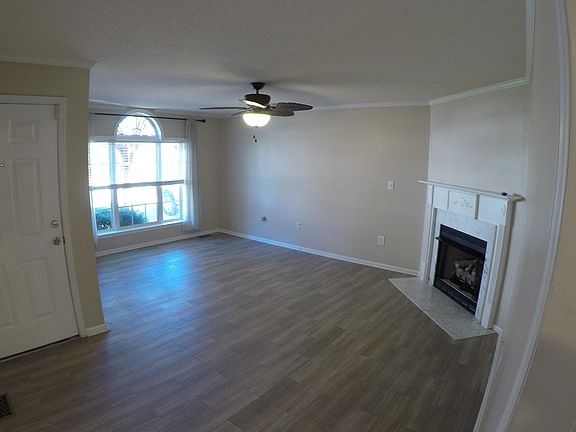 Large LR with corner fireplace and huge front window