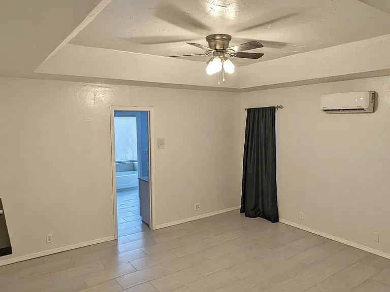 Huge Master Bedroom, with whisper-quiet mini-split, modern flooring, and recently remodeled master bathroom. You'll love the built-in floating shelves that can hold ~25 lbs!