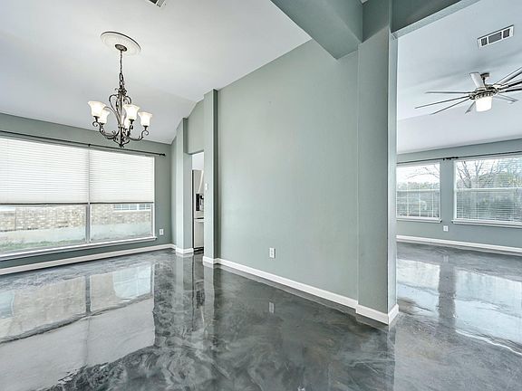 Dining room room to the left and living room to the right. Kitchen accessible from from oth rooms.