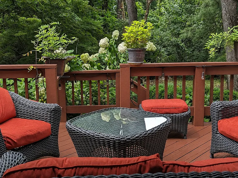 Generous lower deck provides tranquil urban oasis with flowering hydrangeas and planting beds for vegetables. Steps into landscaped gardens. Ideal for meditation, dining or entertaining. HOA landscaping year-round, even blowing autumn leaves from deck.