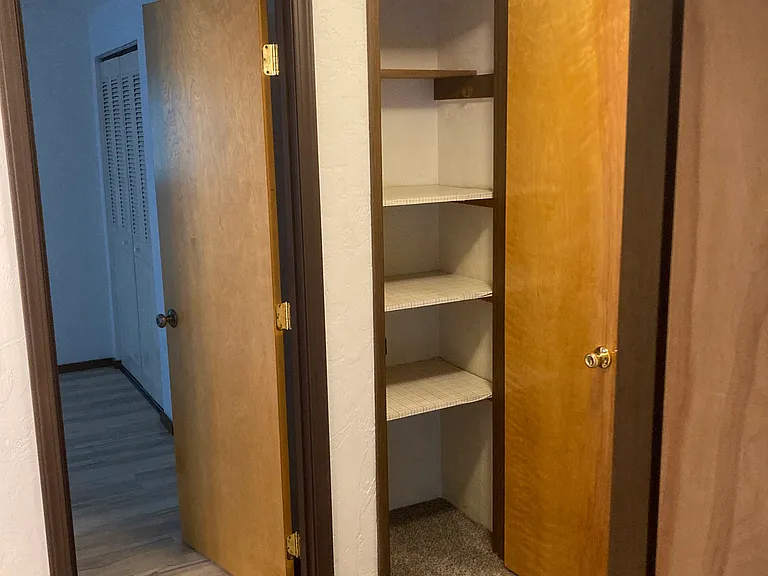 Laundry cupboard at top of stairs