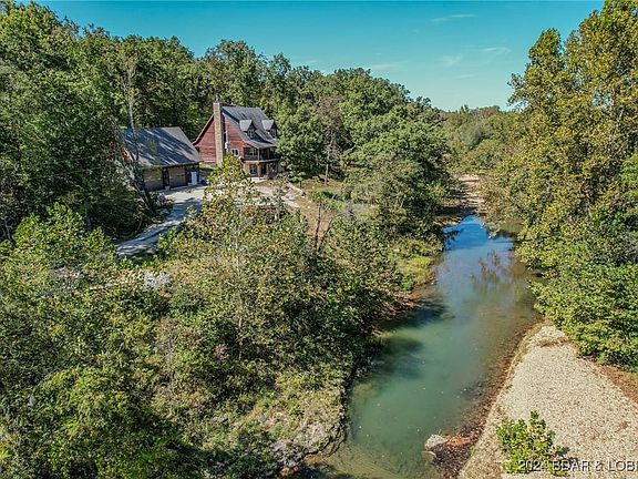 Main Home sits right on Deer Creek with 1 pond