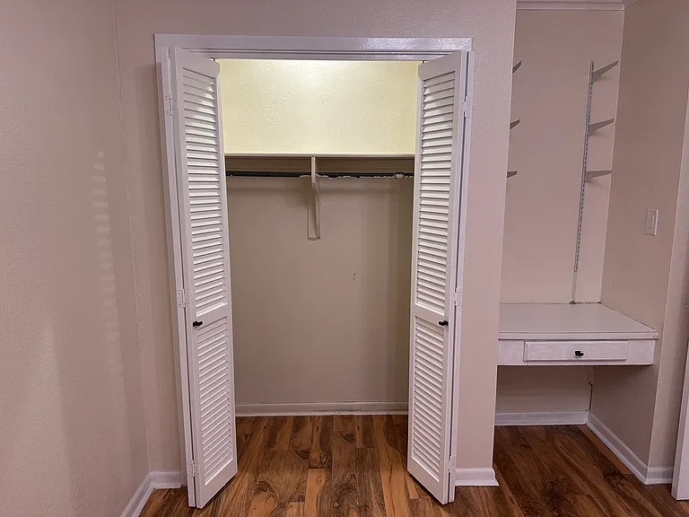 2nd room middle of hallway closet and desk