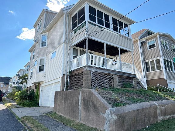 Second floor apartment with third floor finished attic and private, enclosed porch