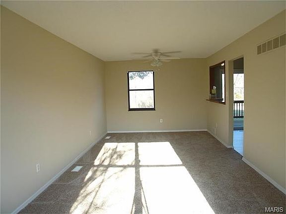 View of the Dining room area. New carpet! Freshly painted!