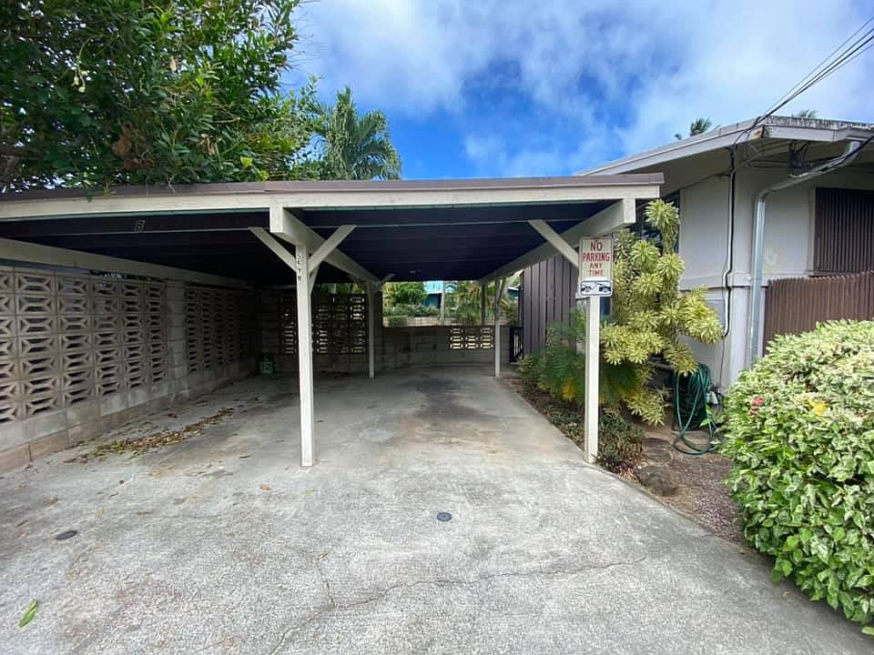 Not shown storage shed in back end of left carport. Room to park small car under carport.