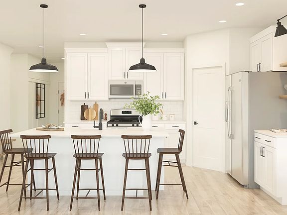 Kitchen with pendant lighting and floating shelves