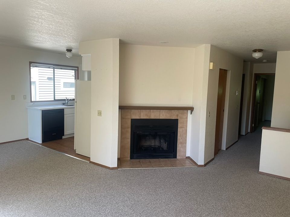 Living, dining, and hallway to bedrooms/bathrooms
