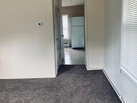 View from living room into kitchen. Pantry and large closet on right.