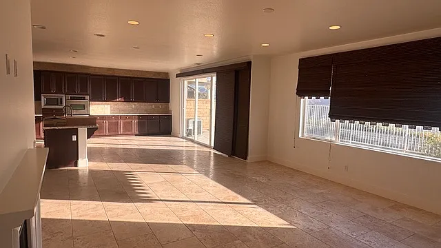 Open Family Room / Dining room with Patio door to back yard with unobstructed views