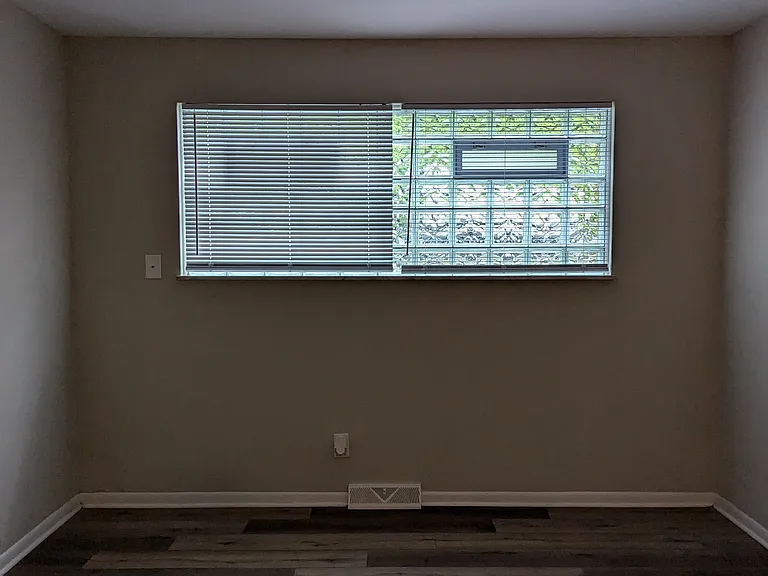 Living Room has beautiful glass block windows that provides natural light and privacy without blinds