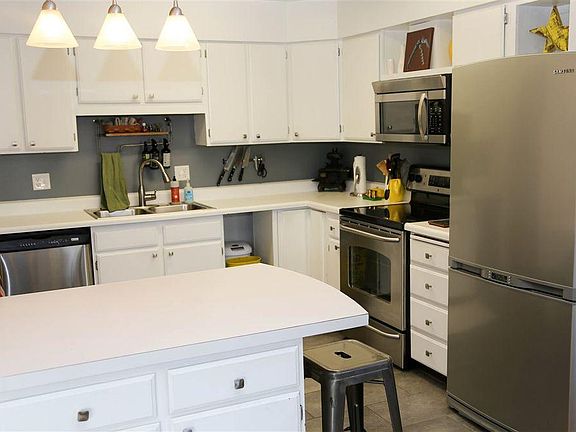 Sleek, modern white with appliances included