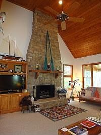 Stone floor to ceiling fireplace...