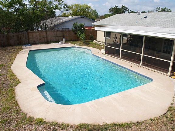 Oversized pool and screened porch for outdoor entertaining