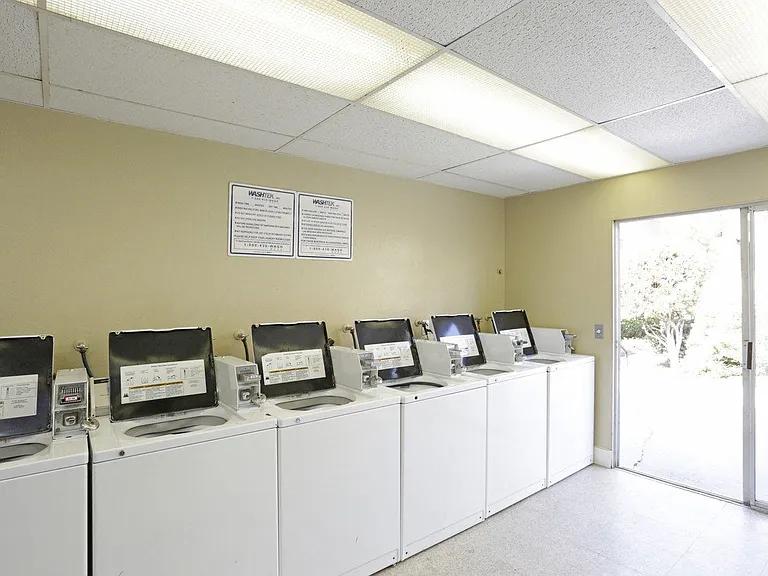 Laundry facility at Villa Pacific Apartments in Oceanside, California.