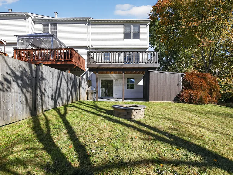 Backyard with patio, shed and firepit