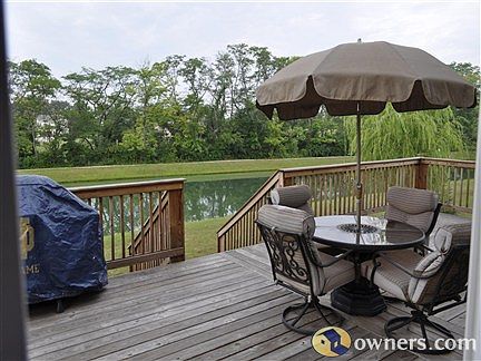 large deck overlooking pond
