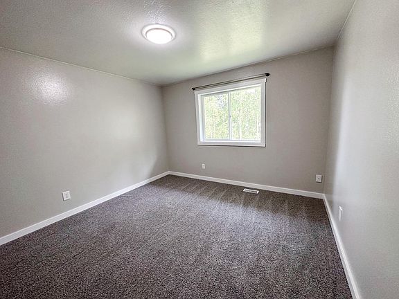 The larger of the upstairs bedrooms has room to move.