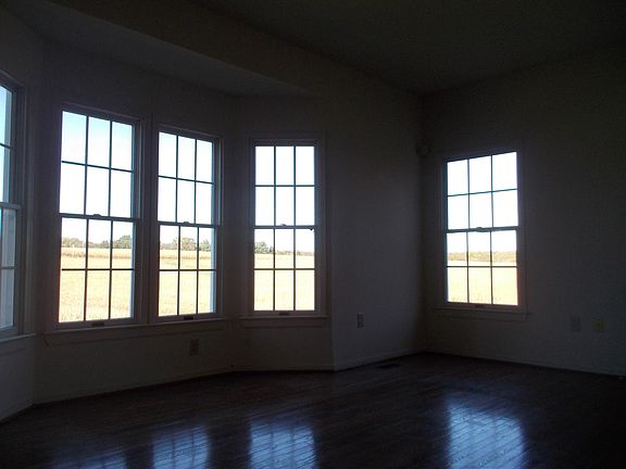 Formal living room with bay windows overlooking 278 private acres