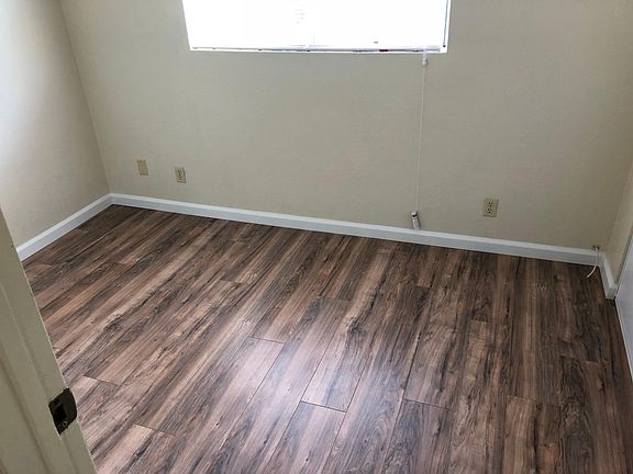 2nd bedroom with closet, laminate floor