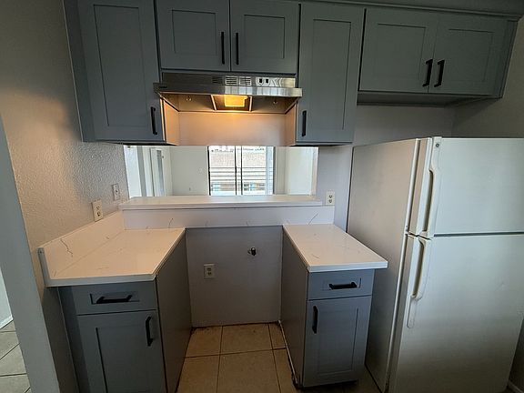 Kitchen with new stove (not picture) and breakfast bar.