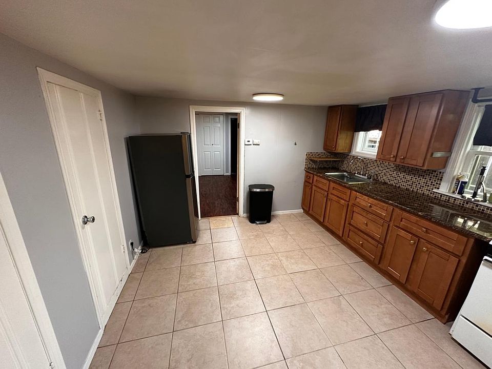 Kitchen/Dinning Room area w/ 2 large Pantry Storage Cabinets.