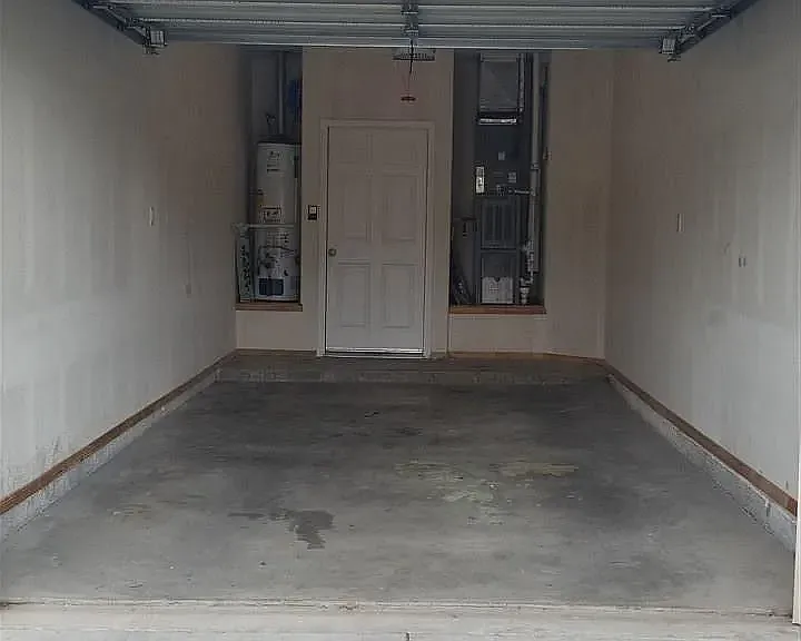 Single car garage. Gas water heater and ac/heat unit in garage. Garage door opener included. Door leads into the laundry room.