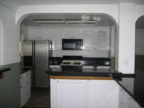 Updated kitchen with breakfast bar, upgraded cabinetry.
