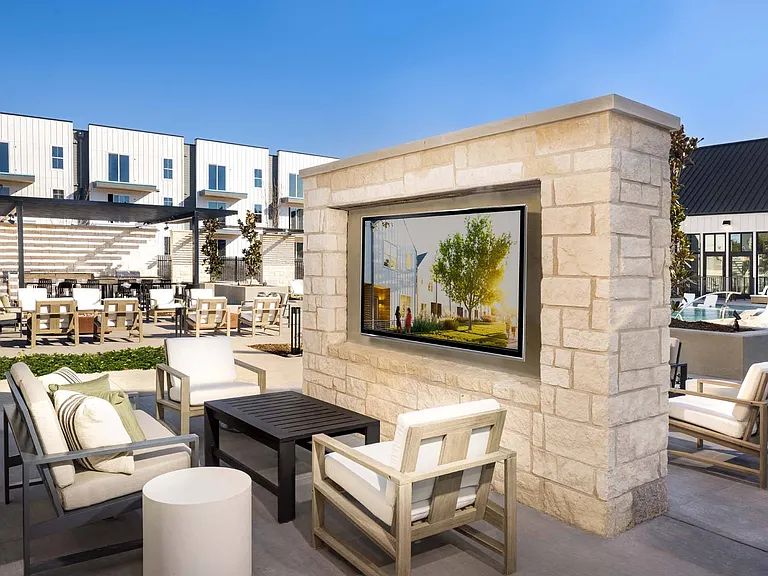 Watch your favorite shows or sports poolside, with comfortable seating and a large screen.