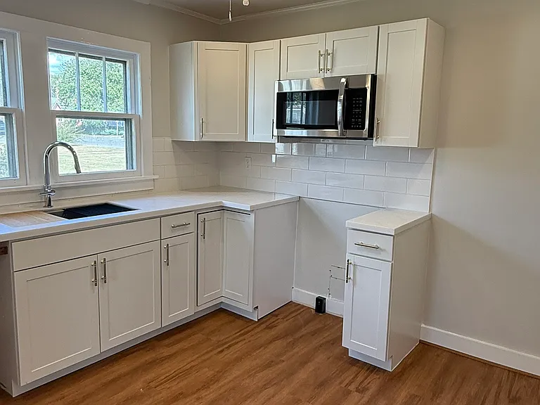 Wide open kitchen with ample room for table and chairs, sink overlooking the back yard, all new cabinetry.
Stainless steel stovetop, dishwasher, and fridge will be provided.