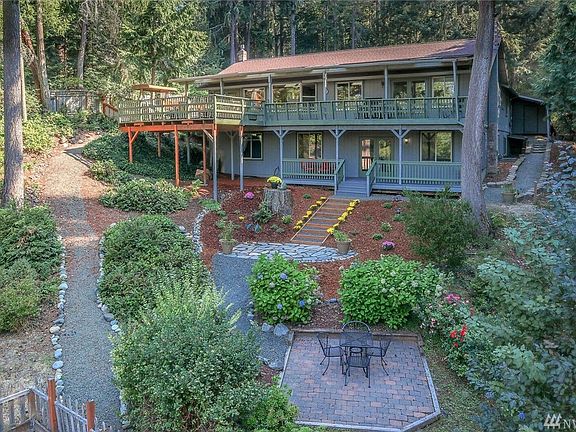 Rear of house, several patios to enjoy.