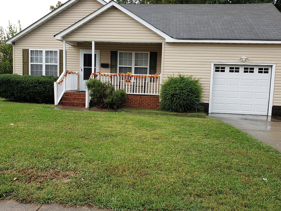 Front of the house featuring the porch. House sits on a quiet street. It is close to 64 and 264, as well as shopping.