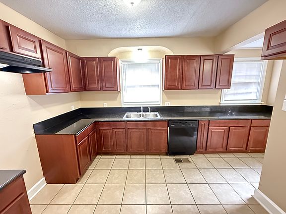 kitchen equipped with a dishwasher and disposal