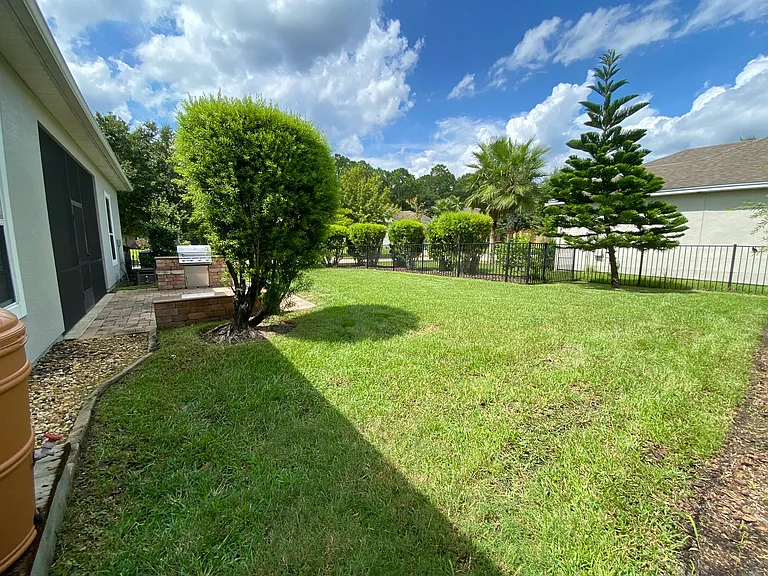 The fenced backyard is perfect for family and pets.