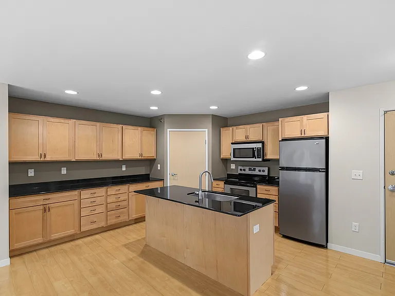 Step into the culinary haven of Overlook Ridge, featuring a spacious kitchen with modern appliances and sleek cabinetry. Perfect for entertaining or everyday meals, this layout blends style and functionality. Schedule your visit today!