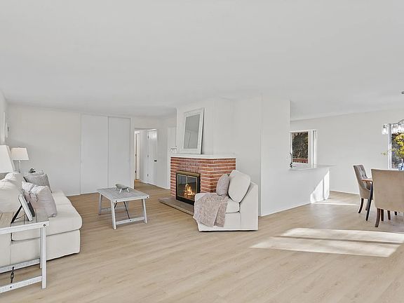 Living room and dining room. Note: unit comes unfurnished.
