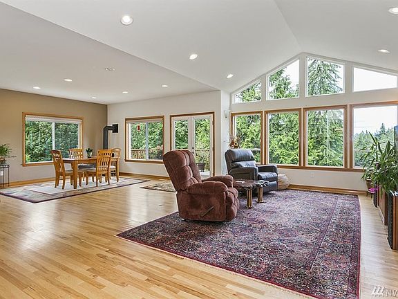 View from the front entry hallway as you enter the living room/great room with vaulted ceiling.