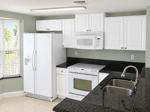 Beautiful Black countertops and white cabinets