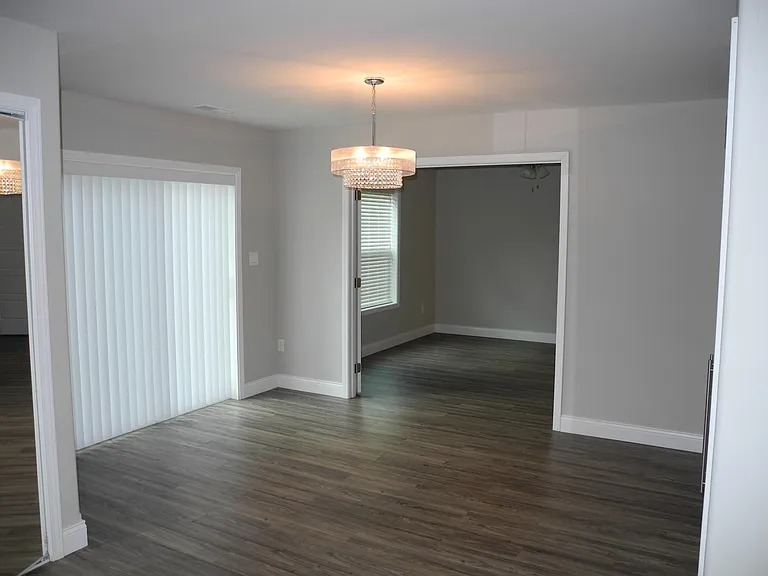 Double doors open from dining room into fourth bedroom which can be converted to a study