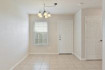 Tile throughout except the bedrooms