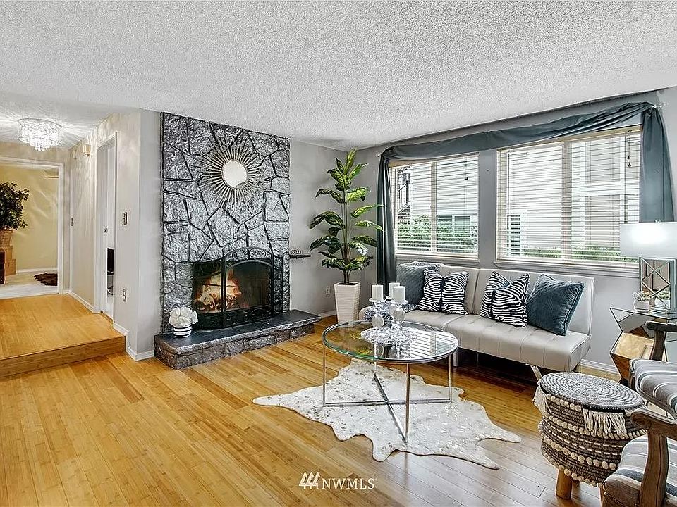 Beautiful sunken living room with wood burning fireplace